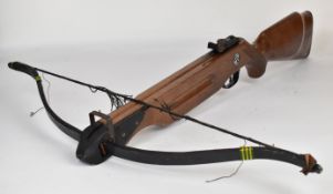 Barnett Wildcat crossbow with wooden stock, chequered semi-pistol grip and adjustable sights.