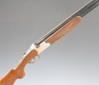 Felix Sarasketa 12 bore over and under shotgun with engraved locks, underside and thumb lever,