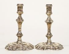 Pair of George II hallmarked cast silver candlesticks or taper sticks, one London 1737 maker William