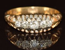 A c1910 18ct gold ring set with five diamonds, 3.4g, size O