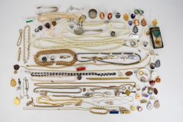 A collection of jewellery including two pearl necklaces, four silver rings, silver pendant and