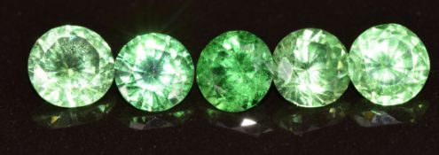 Five loose round cut tsavorite garnets, of approximately 0.7ct, 0.75ct, 0.7ct, 0.6ct & 0.7ct
