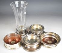 Modern hallmarked silver mounted items comprising two candle holders, two wine bottle coasters and a