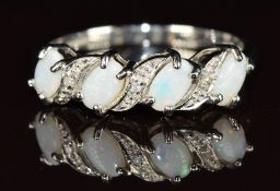 A 9ct white gold ring set with opals and diamonds, 2g, size O