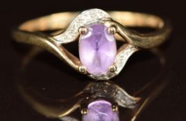 A 9ct gold ring set with an amethyst and diamonds, 2.4g, size V