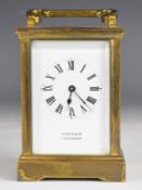 Martin & Co. Cheltenham gilt cased carriage clock with bevelled glass panels, height including