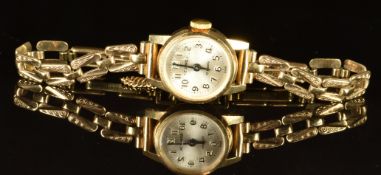 Sekonda 9ct gold ladies wristwatch with black hands and Arabic numerals, silver dial and 17 jewel
