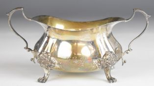 Poole sterling American silver twin handled sugar bowl raised on four lions paw feet, length 15.5cm,