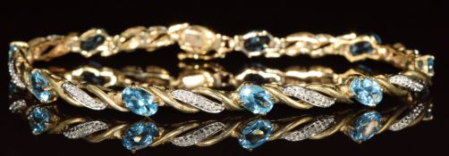 A 9ct gold bracelet set with topaz and diamonds, 6.8g, 17cm