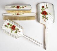 Elizabeth II hallmarked silver and floral guilloché enamel dressing table set comprising hand
