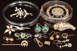 A collection of jewellery including silver flapper bangle (Birmingham 1922), Victorian mourning