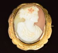 A yellow metal brooch set with a cameo depicting a young woman, 7.6g, 3 x 3.4cm