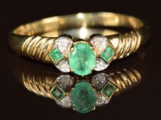 A 9ct gold ring set with emeralds and diamonds, 2.1g, size T