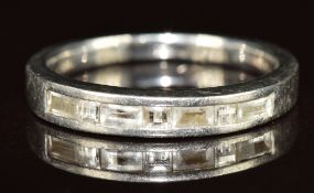 A platinum ring set with princess and baguette cut diamonds, 4g, size K/L