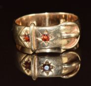 A 9ct gold buckle ring set with garnets, 4.9g, size R