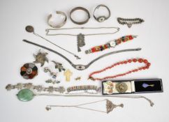 A collection of jewellery including two silver bangles, curb link bracelet with heart padlock clasp,