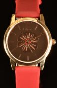 Clogau ladies wristwatch with rose gold dial decorated with a poppy, gold hands and hour markers,