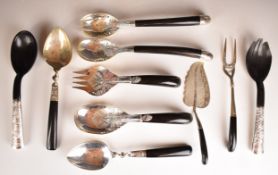 Ten eastern silver and horn or similar serving scoops and forks, length of longest 30cm