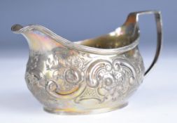 Georgian hallmarked silver milk jug with embossed decoration, London 1817, maker Thomas Wallis (