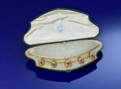 Victorian/ Edwardian yellow metal necklace with five lockets/ drop pendants each set with an oval