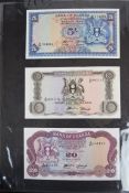 Collection of approximately 200 African banknotes in an album including Uganda, St. Thomas & Prince,