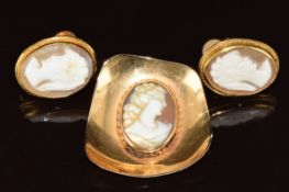 A 15ct gold pendant / brooch set with a cameo (2.5 x 2.8cm) and a pair of 9ct gold earrings set with