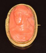 Victorian yellow metal brooch/ pendant set with a coral cameo depicting a young woman, 5.6g