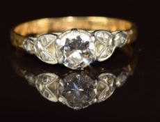 An 18ct gold ring set with a diamond of approximately 0.55ct in a platinum setting, 2g, size N