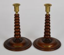 Pair of treen candlesticks with brass plaques 'Made from Timber Taken From HMS Renown', H23cm