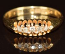 An 18ct gold ring set with five diamonds, Birmingham 1919, 3g, size N