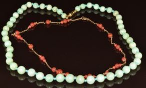 A single strand of graduated jadeite beads and a 9ct gold necklace with glass beads