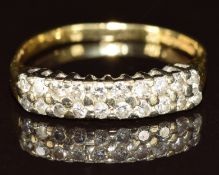 An 18ct gold ring set with two rows of diamonds, 2.6g, size O