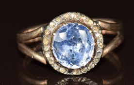 Victorian rose gold ring set with a foiled old cut Ceylon sapphire of approximately 2ct surrounded