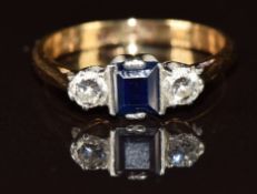 An 18ct gold ring set with a square cut sapphire and two diamonds, 2.9g, size L