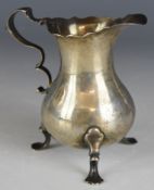 Georgian hallmarked silver milk or cream jug raised on three feet, London 1739, maker’s mark IW,
