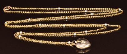 A c1915 15ct gold guard chain set with pearls (14.3g, 130cm) and yellow metal heart locket set