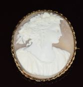 A yellow metal brooch set with a cameo depicting a young woman, 4 x 5cm, 12.6g
