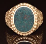 A 9ct gold ring set with bloodstone, with embossed floral shoulders, 9.4g, size W
