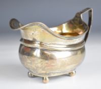 Georgian hallmarked silver milk jug raised on four ball feet, London 1808, maker's mark