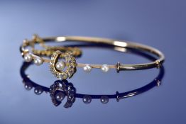Victorian yellow metal bangle set with old cut diamonds and natural pearls in the form of a