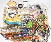 A collection of jewellery including ten silver rings, two 9ct gold rings (3g), beaded necklaces,
