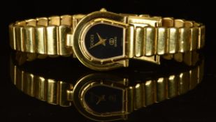 Gucci ladies wristwatch ref. 7000 with gold hands, black dial, gold plated horseshoe shaped case and