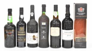 Six bottles of vintage Port and Madeira to include Taylor's 1988, Cossart Gordon 1989, Henriques &