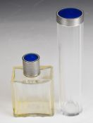 Two French silver and white and blue guilloché enamel topped cut glass dressing table bottles, one