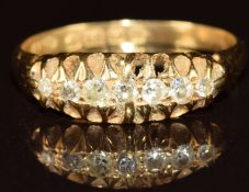 An 18ct gold ring set with seven diamonds, Birmingham 1912, 2.6g, size O
