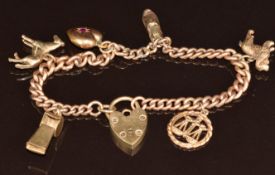 9ct gold charm bracelet with six 9ct gold charms including spaniel, horse, whistle, shoe, heart