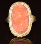 A 9ct gold ring set with a Victorian coral cameo depicting a young woman, 5.8g, size N