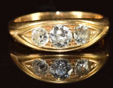 A c1900 18ct gold ring set with three old cut diamonds measuring approximately 0.4ct, 0.2ct and 0.