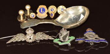 A silver caddy spoon, silver 'North Irish Horse' brooch set with enamel and paste, silver RAF brooch