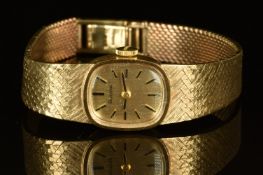 Bulova 9ct gold ladies wristwatch with black hands and hour markers, gold dial and signed 17 jewel